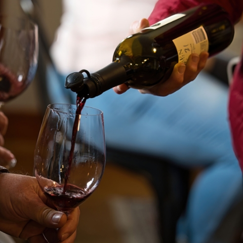 Wine being poured into a glass